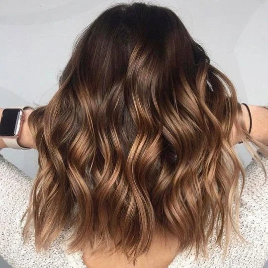 Dark brown with caramel ombre balayage