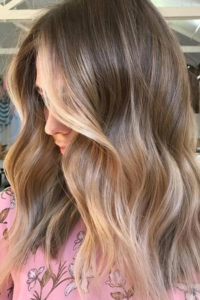 Beige blonde with subtle golden balayage